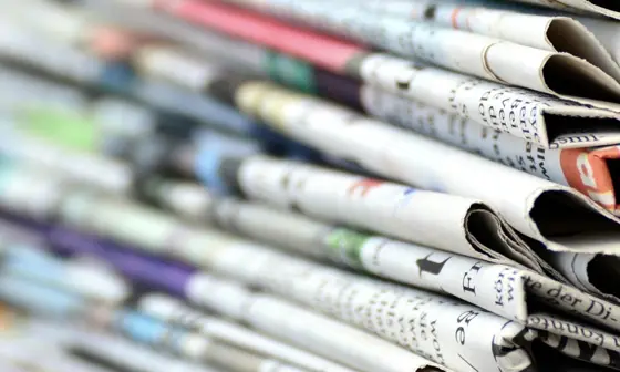 Close-up photo of pile of newspapers