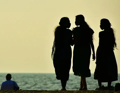 Three women on a beach