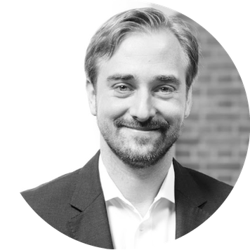 smiling headshot image of professor Daniel wiesen.