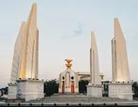 A round monument surrounded by four pillars