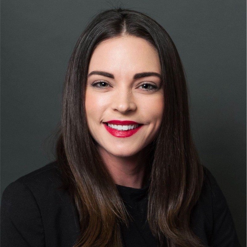 Headshot of a woman with a dark hear 