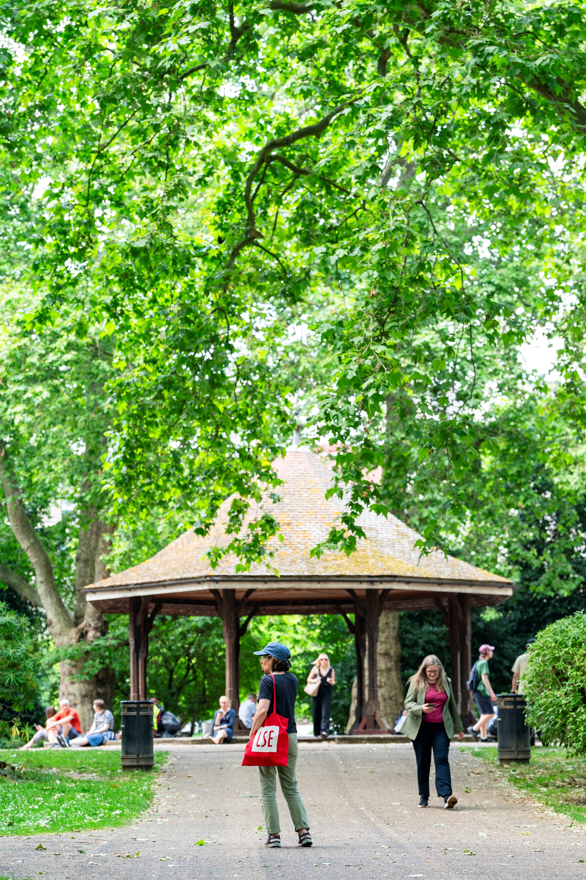 An LSE student standing in a park