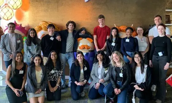 A group of students pose together on a trip to the Google offices