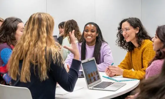 a group of students laugh together