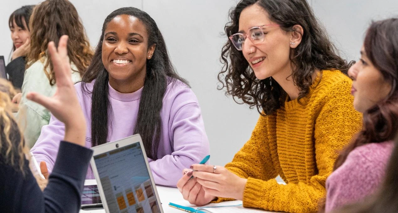 a group of students laugh together