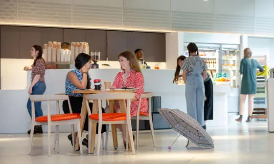 Postgraduate students having a coffee and chat in the Beaver's Brew cafe