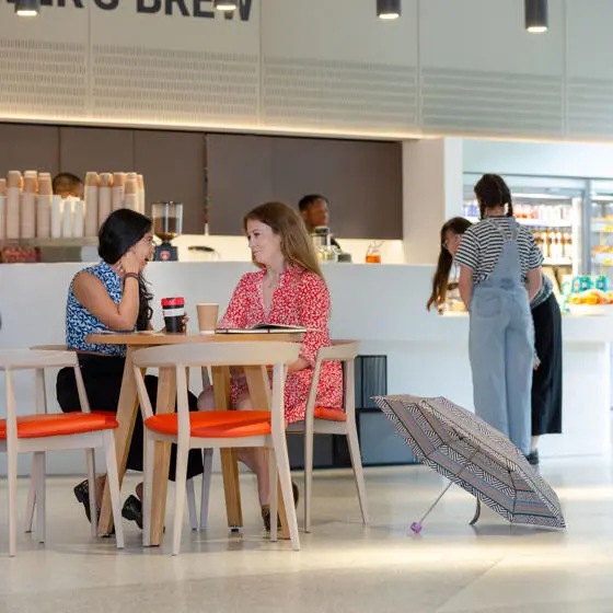 Postgraduate students having a coffee and chat in the Beaver's Brew cafe