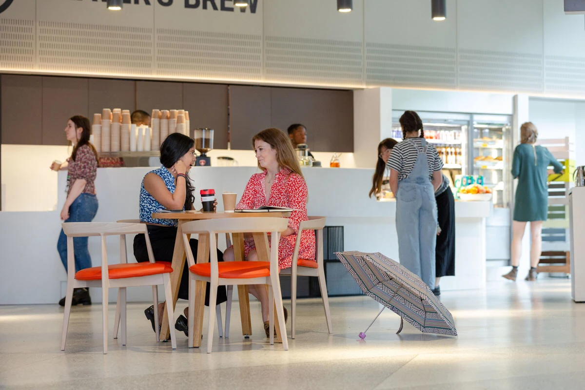 Postgraduate students having a coffee and chat in the Beaver's Brew cafe