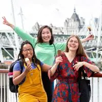 three students smiling