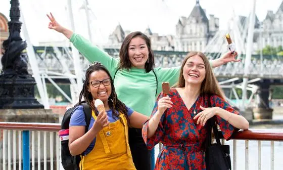 three students smiling