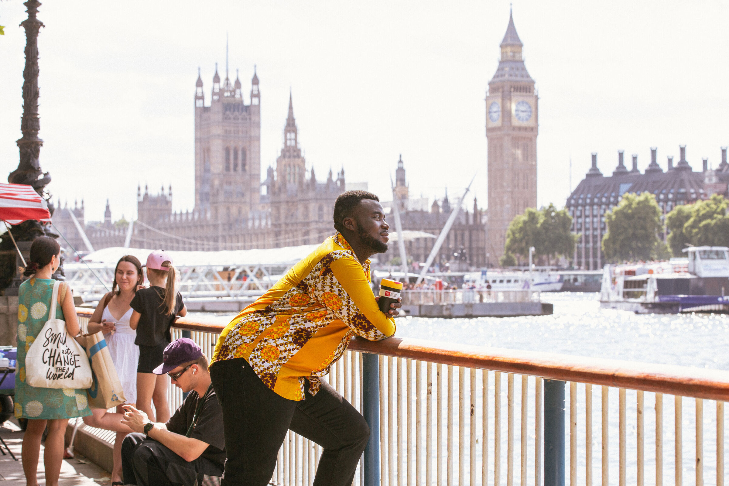 LSE student looking out over bridge in London with view of Westminster