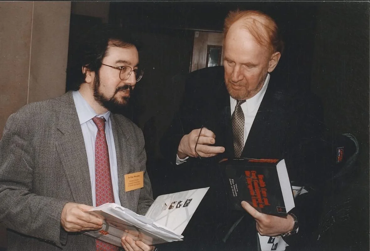 Elias Mossialos gifting a book to Professor Egon Jonsson, then CEo of the Swedish Agency for Health Technology Assessment and Assessment of Social Services (SBU)