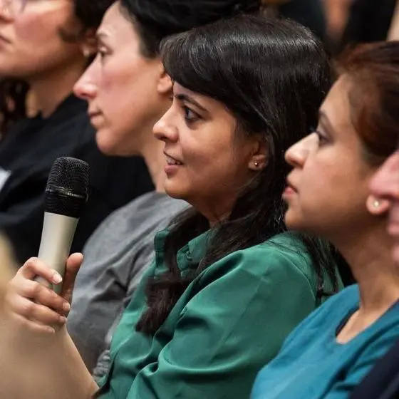 woman holding microphone in audience
