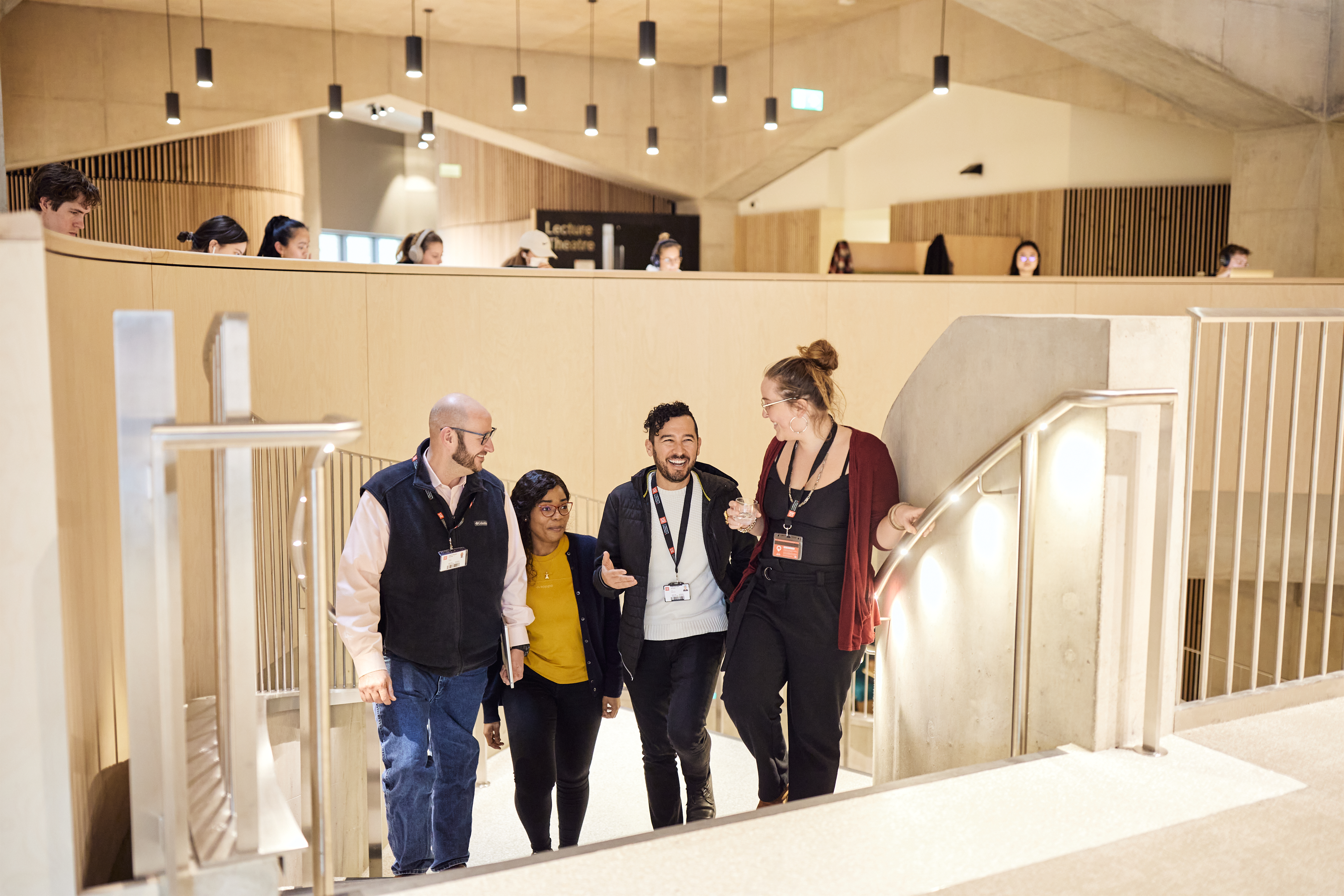 Four EMSBE students walking together in conversation.