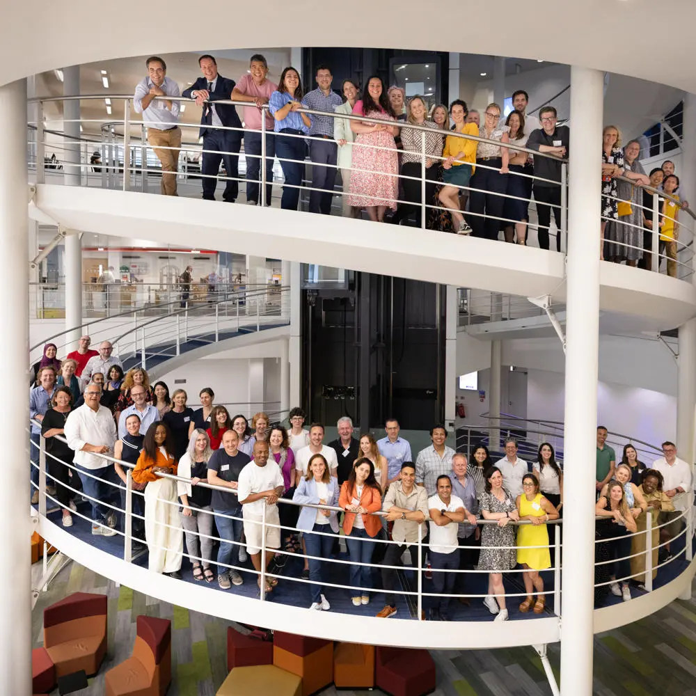 EMSc alumni on LSE library stairs in 2024