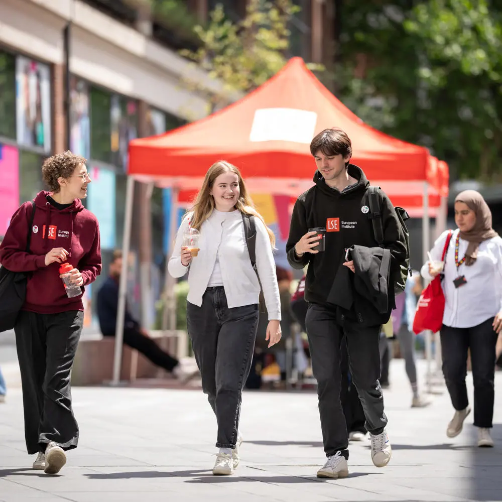 Students walking and chatting on campus