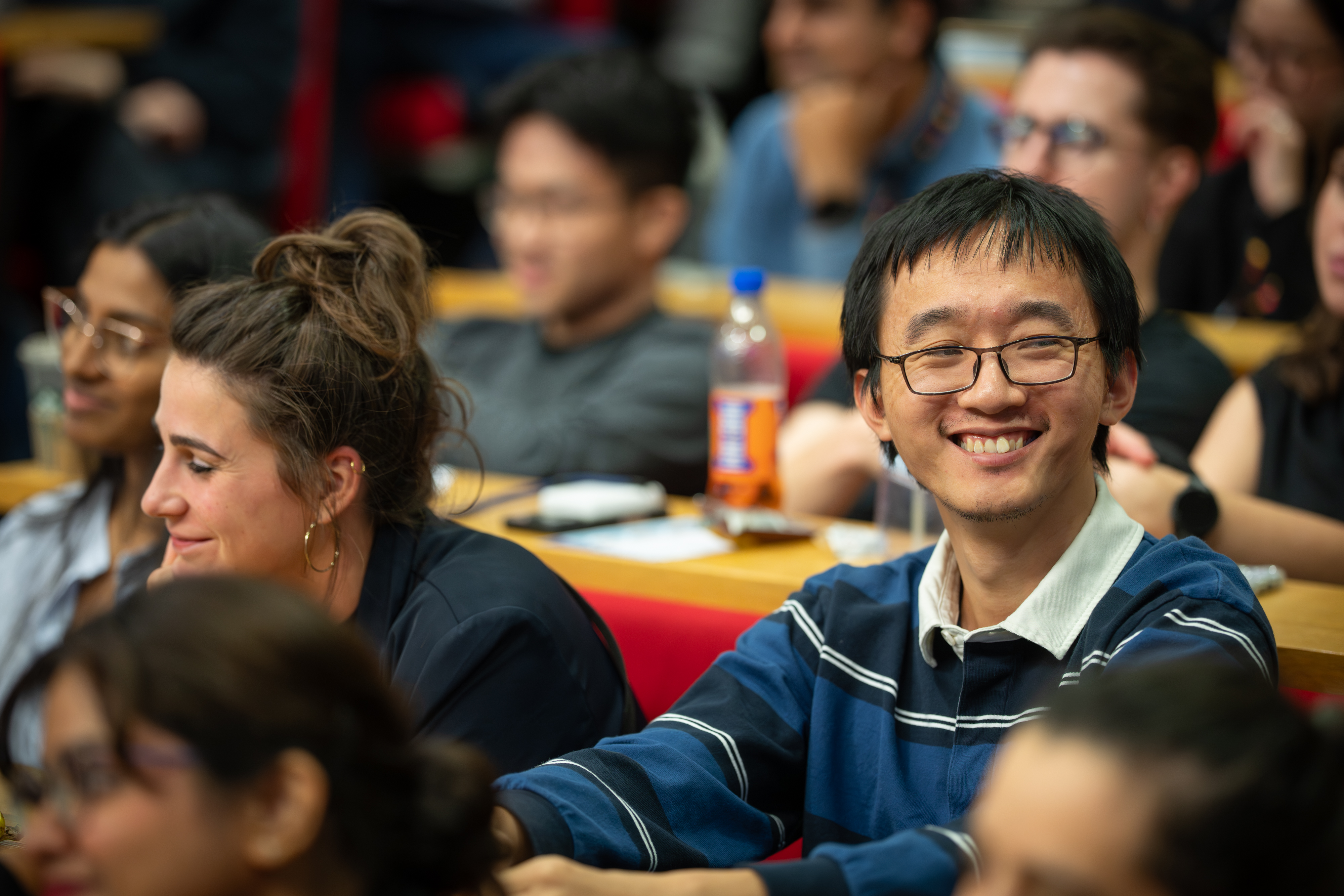Audience members smiling.