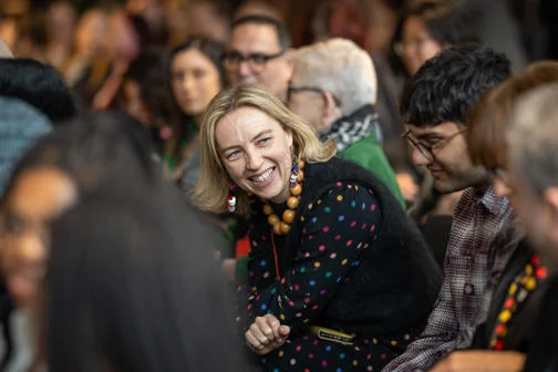An audience member smiling.