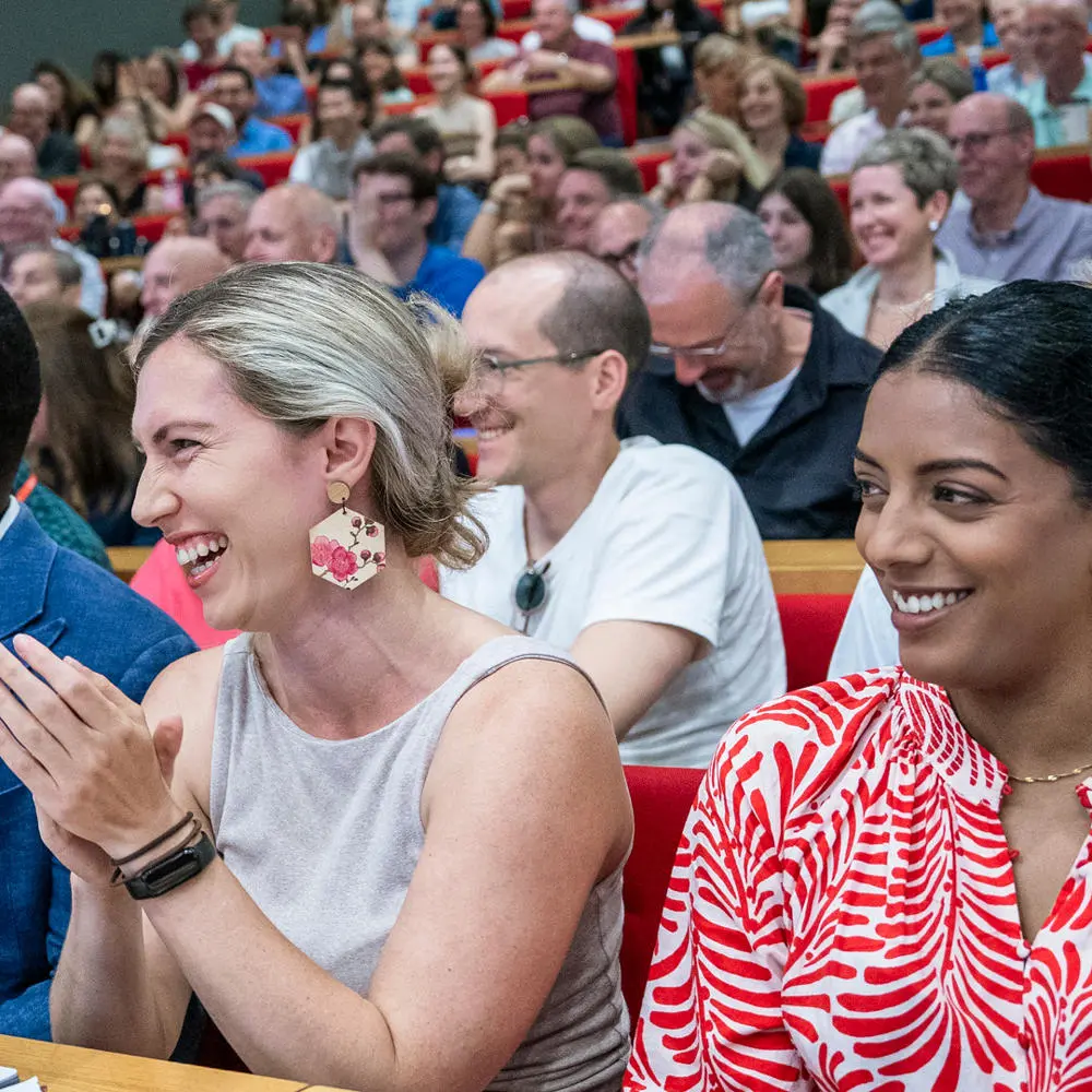 Events audience clapping and smiling