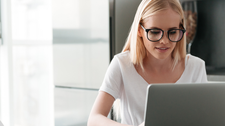 young woman with laptop online