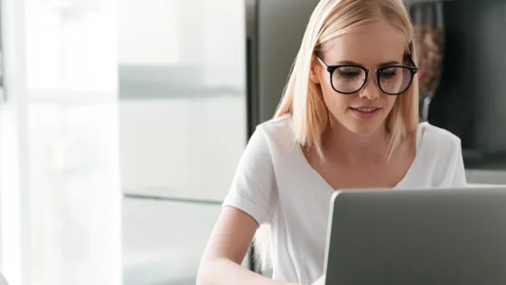 young woman with laptop online