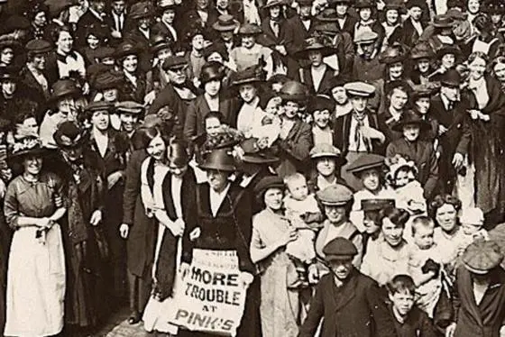 A group of people at a demonstration marching.