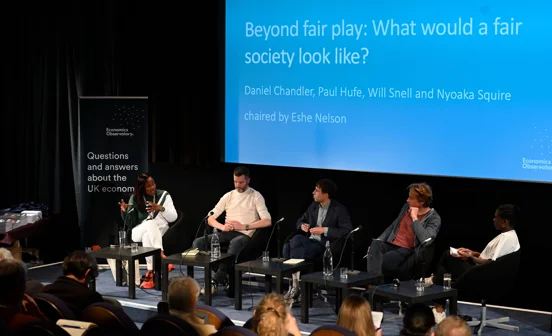 An slide titled "Beyond fair play: what would a fair society look like" with a panel sitting in front.
