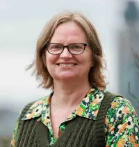 Flora Cornish headshot, a woman smiles at the camera