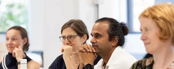 Four emsc alumni in classroom