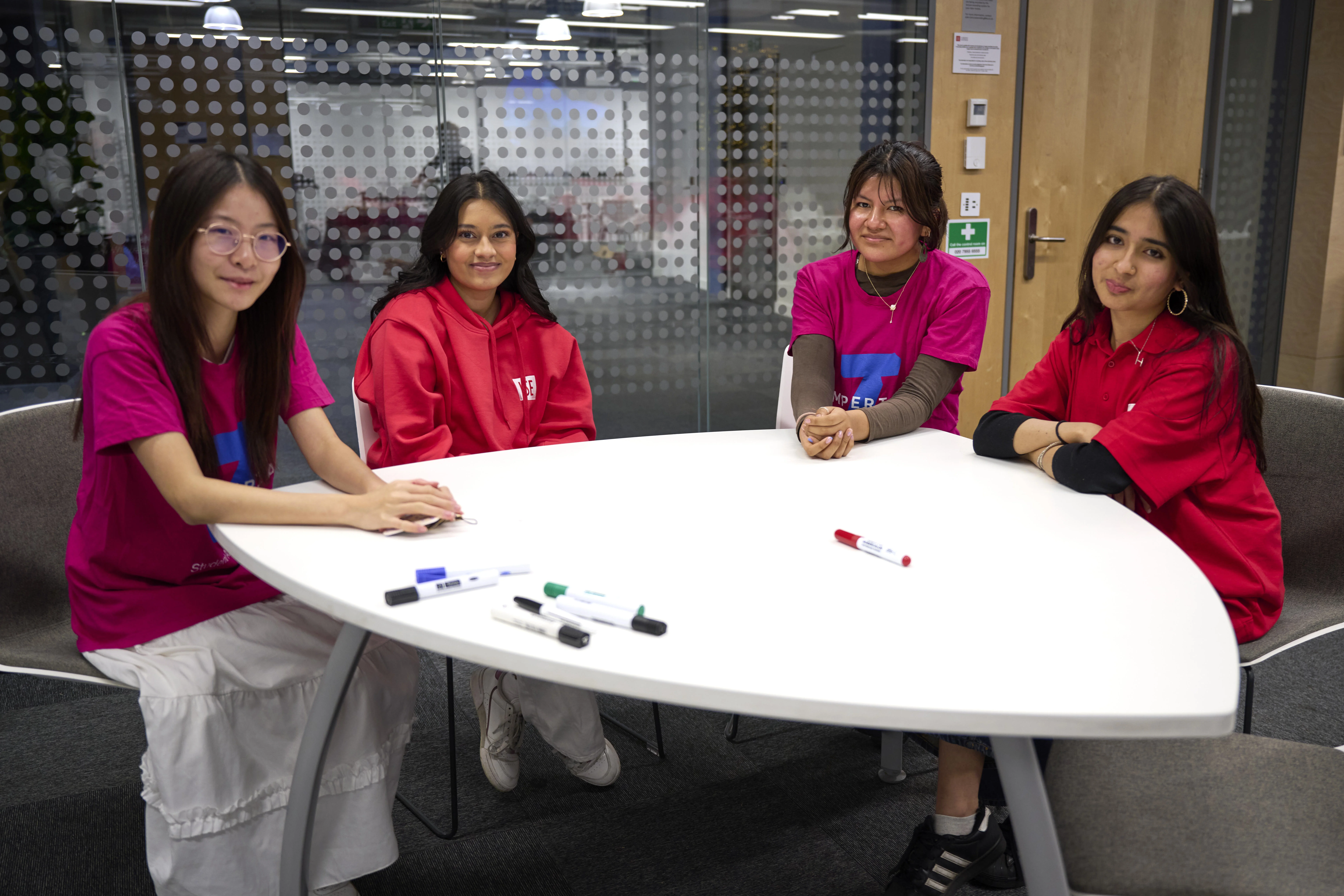A group of four Future Maths student tutors at a training day