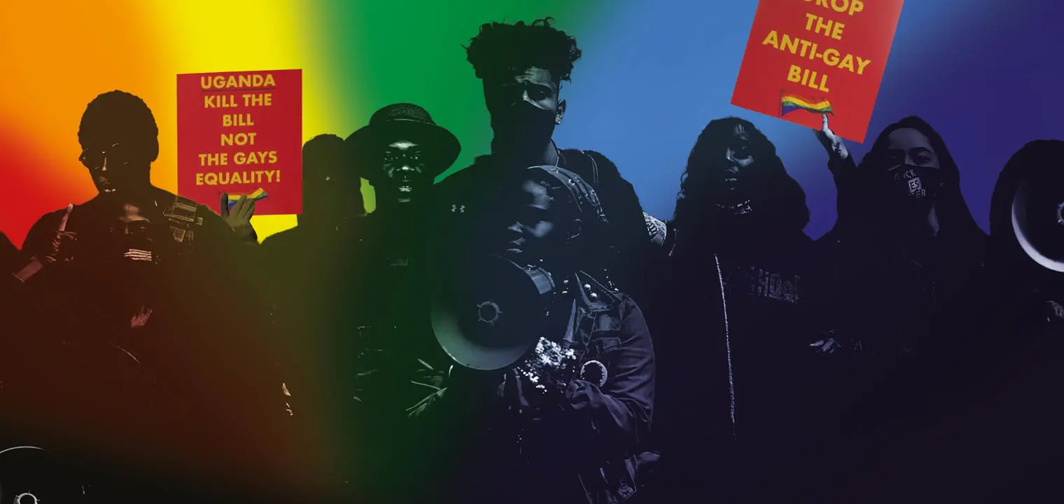 A crowd of people with protest signs that say 'Drop the anti-gay bill' and 'Uganda kill the bill'.