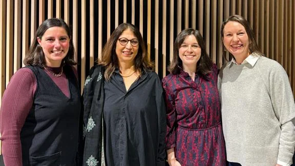 Laura Antona, Shirin Rai, Sarah Marie Hall and Claire Mercer smiling to camera.