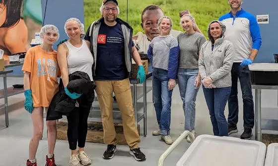 Alumni volunteers pose a photo following a day of volunteering with a food poverty charity