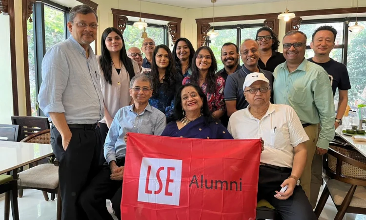 A group of alumni celebrated Global Networking Night in Kolkata, holding up the LSE alumni flag.