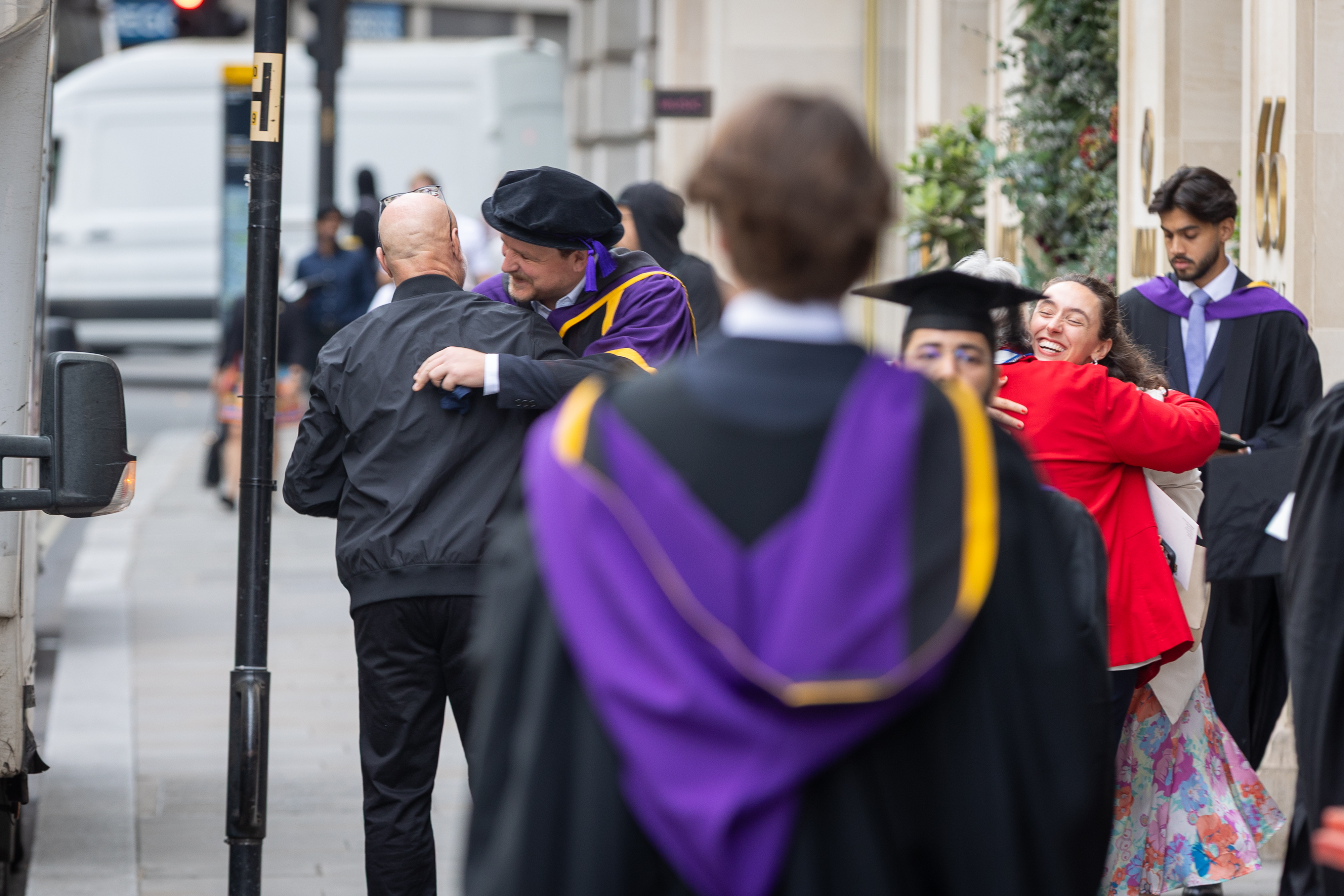 Graduates and family members hugging