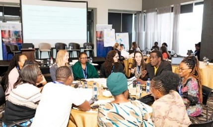 Workshop with representatives and academics collaborating around a table working on gender equality issues