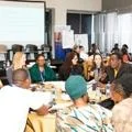 Workshop with representatives and academics collaborating around a table working on gender equality issues