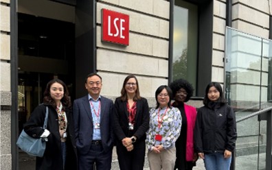 Faculty team standing outside LSE building 