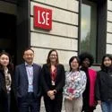 Faculty team standing outside LSE building