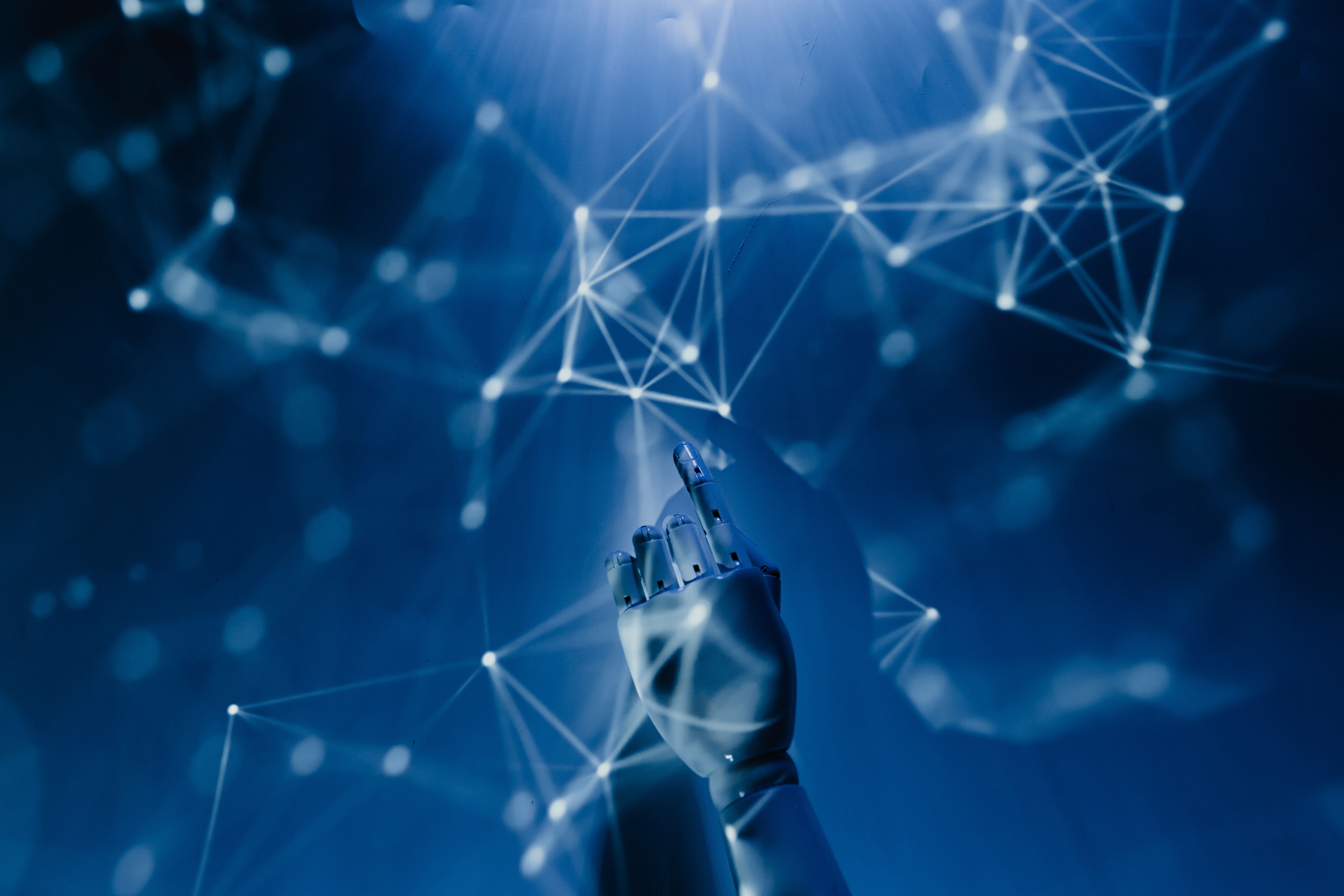A model of a hand overlaid by abstract data pathways