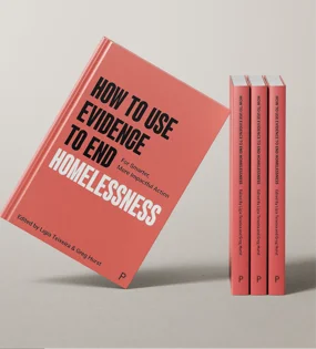 Red book titled how to use evidence to end homelessness