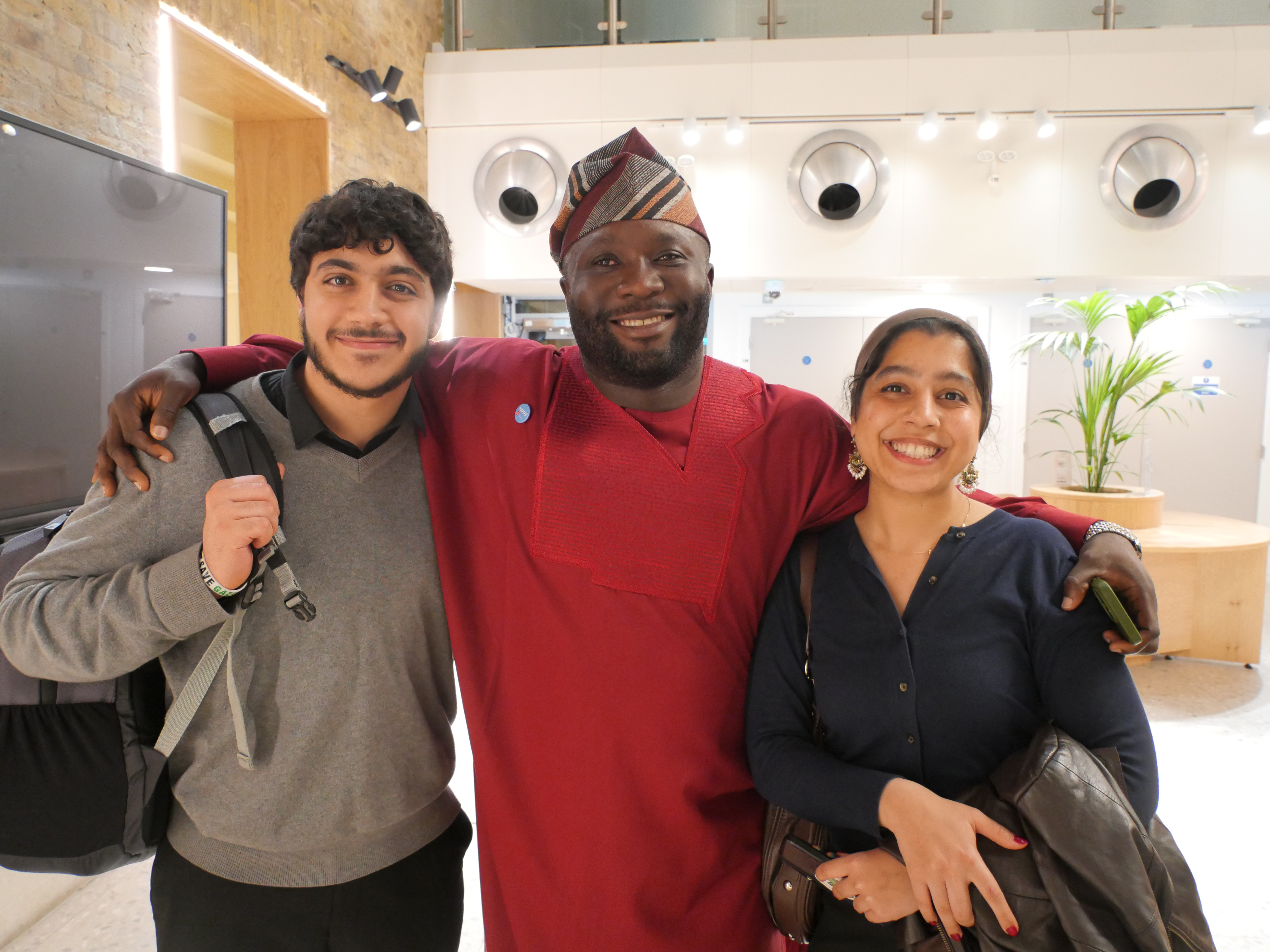 HPPF 40th Anniversary -Day 1 picture of 3 attendees smiling at the camera 