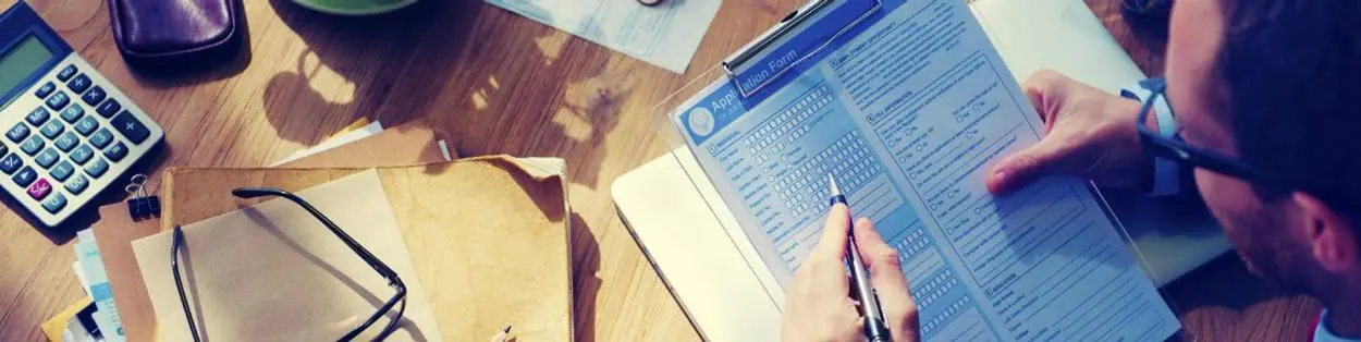 a man filling in a form
