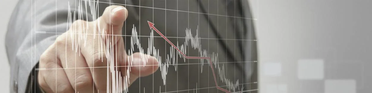 a man pointing to a graph