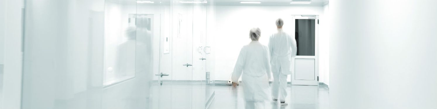 two doctors walking down a corridor