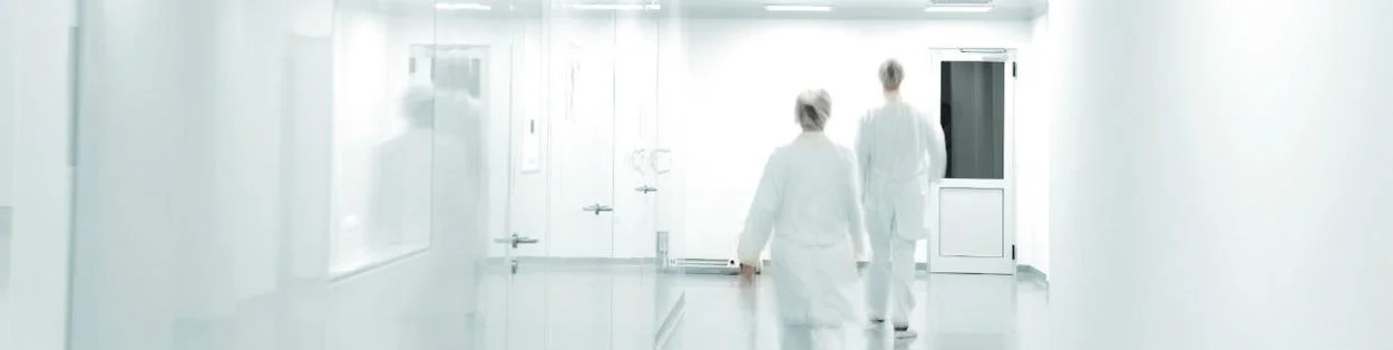 two doctors walking down a corridor