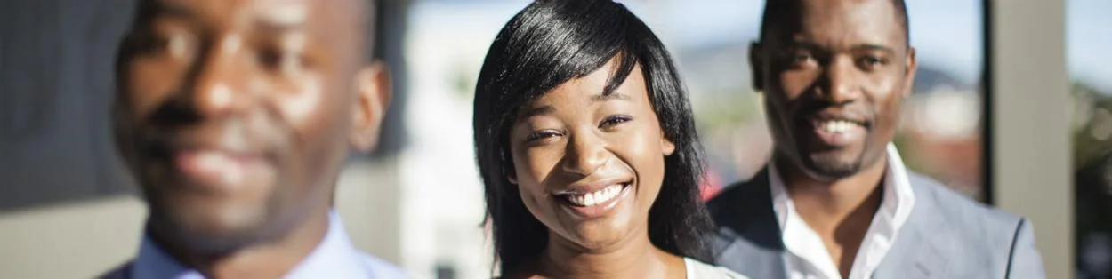 three people smiling