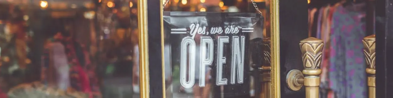 A shop front with an 'open' sign.