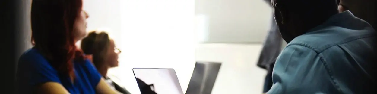 People sitting in a boardroom.