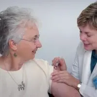 Older person receiving a vaccine